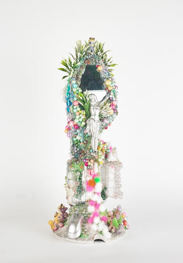Hypermonalisa, crucifix assembled from toys, beads and plastic trinkets